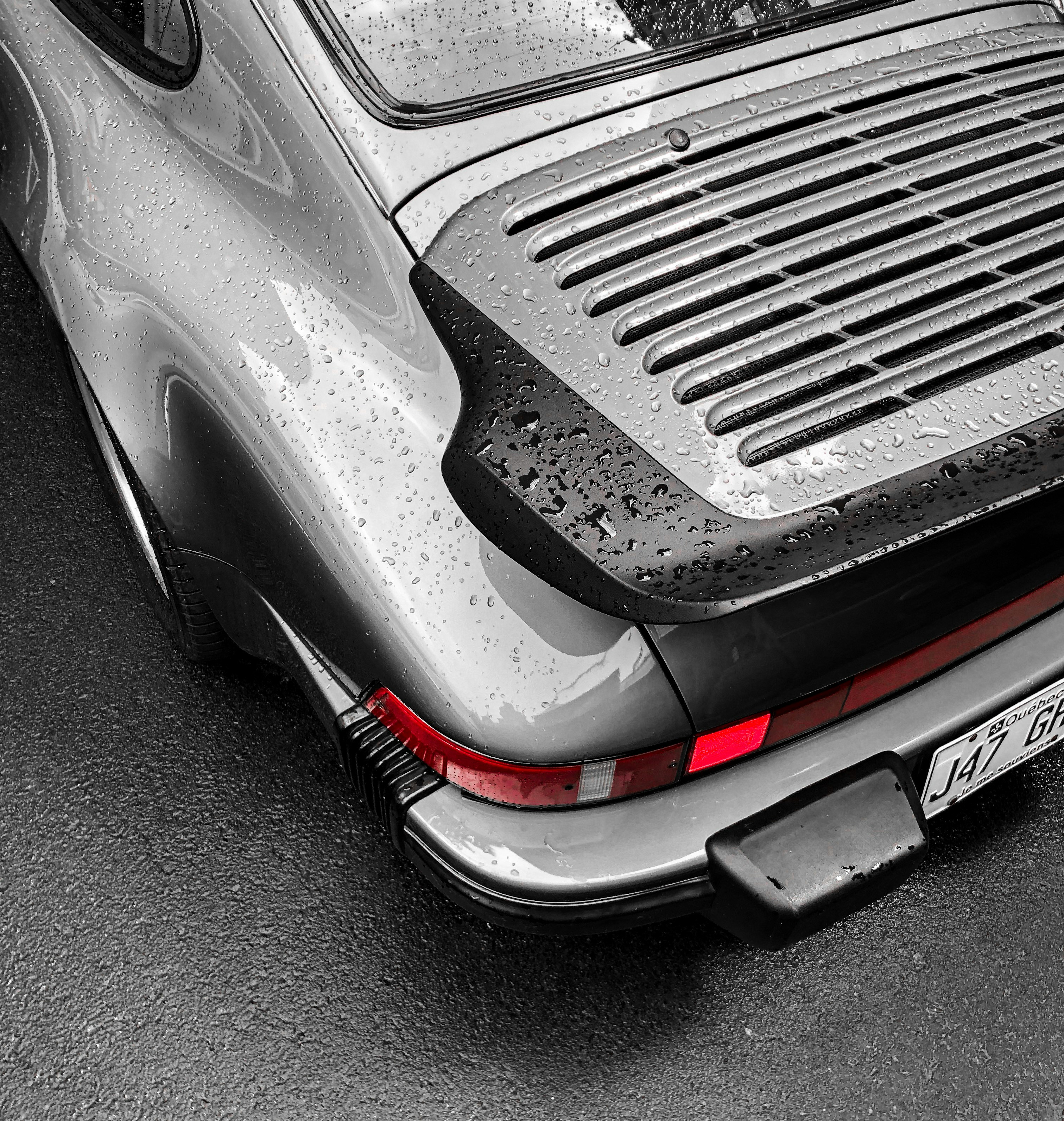 Glossy black Porsche 911 rear view